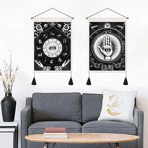 Bohemian Hamsa Hand and Zodiac wheel wall tapestries with tassels hanging in a living room