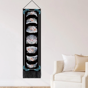 Black vertical moon phase tapestry with floral elements and tassels for home decor