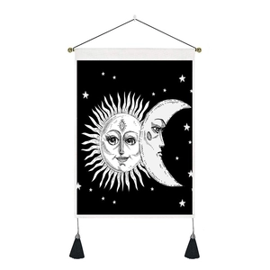Bohemian sun and moon wall hanging with black tassels and minimalist star pattern