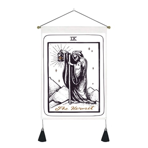 The Hermit tarot card wall tapestry with black tassels and gold lettering decor