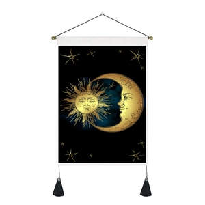 Japanese celestial sun and moon tapestry with gold accents and black hanging tassels