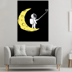 Detailed texture of astronaut canvas wall art hanging above a modern grey fabric sofa