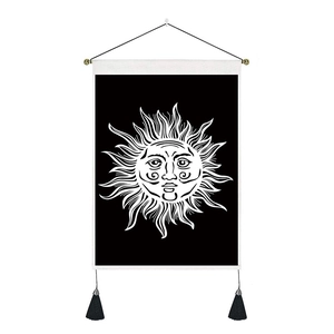 Bohemian sun totem wall tapestry in black and white with decorative tassels and hanging rod