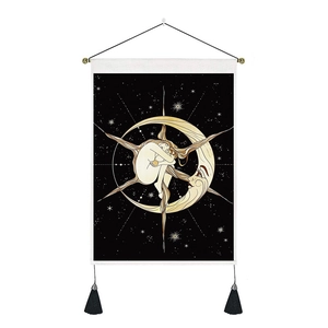 Detail of hanging tapestry featuring a girl on a crescent moon with tassels and rod