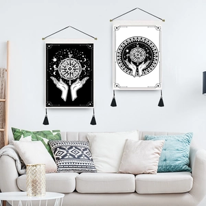 Bohemian mandala wall hanging set with sun moon design and black tassels on white wall