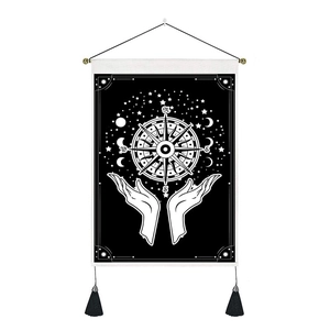 Bohemian mandala tapestry with hand and compass design on black canvas with tassels