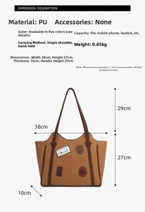 Detail view of large PU leather tote bag with vintage patches and precise dimensions