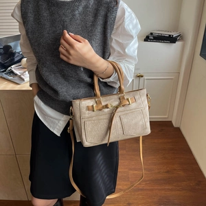 Retro khaki crossbody tote bag with pocket details and adjustable shoulder strap