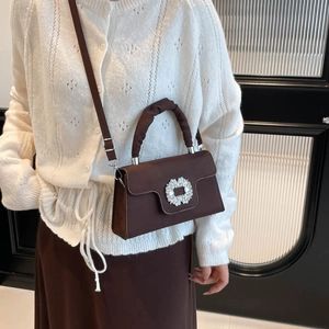Dark brown pleated handbag with sparkling rhinestone buckle and slim shoulder strap