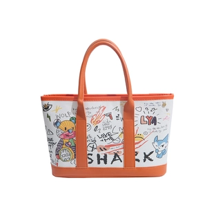 Graffiti canvas tote bag with orange leather handles and cartoon bear prints