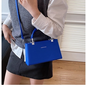 Royal blue crossbody box bag in lychee texture leather with silver metal buckle detail