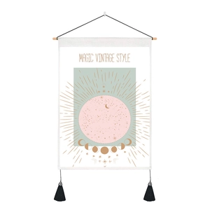 Detail of tarot tapestry with pink moon phases, vintage stars, and black tassels