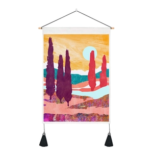 Detail of artistic woven tapestry with colorful cypress trees and black tassel accents