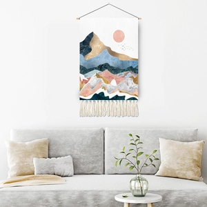Abstract mountain landscape wall tapestry with blue and gold tones and cotton tassels