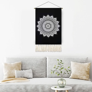Bohemian black mandala wall tapestry with white geometric pattern and cotton fringe