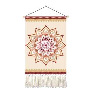 Detail of bohemian mandala tapestry with red geometric patterns and white tassels