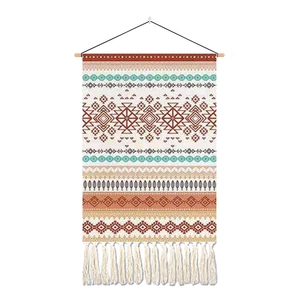 Bohemian geometric tapestry with ethnic patterns and white cotton tassels for wall decor