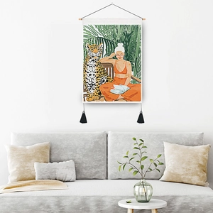 Artistic wall hanging featuring a woman and leopard in a lush tropical forest illustration