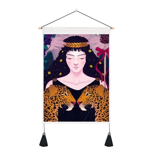 Artistic wall tapestry with tassels featuring leopard and woman illustration