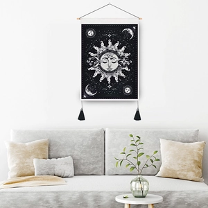 Bohemian sun and moon wall tapestry with celestial motifs and elegant black tassels