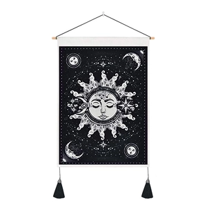 Bohemian sun and moon tapestry wall hanging with black tassels and wood rod hanger