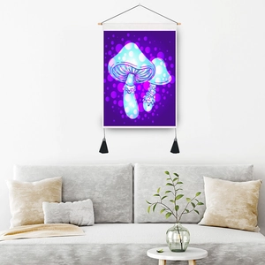 Modern mushroom fabric wall hanging with neon colors and black tassels in living room