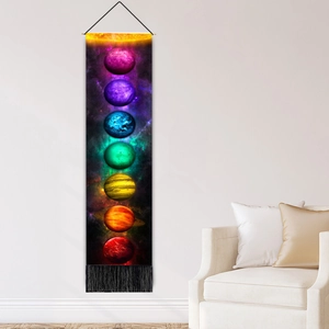 Vertical bohemian wall tapestry featuring cosmic planets and black tassels for home decor