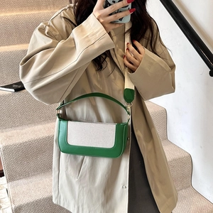 Retro green leather and canvas contrast small square bag shown in a mirror selfie