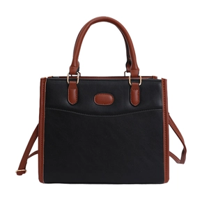 Minimalist black and brown contrast faux leather tote bag with gold metal hardware