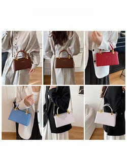 Detailed look at woven texture box handbags in various colors with gold hardware
