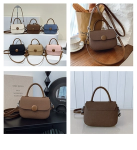 Detailed view of fashionable mini saddle bag featuring a large round decorative buckle