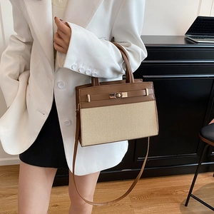 Retro two-tone patchwork handbag featuring brown leather top and beige woven texture detail