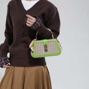 Green leather trim straw woven handbag with printed silk scarf handle and metal lock
