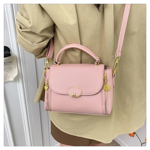 Pink lychee grain faux leather handbag with gold M-logo buckle and side zipper details