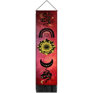 Detail of Moon Child tapestry featuring sun, moon phases, and snakes with black tassels
