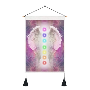 Detail of colorful chakra spheres and white wings on a mystic vertical tapestry