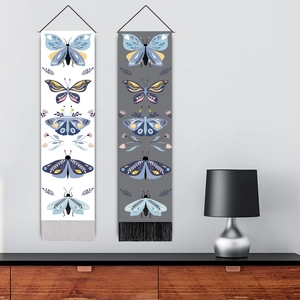 Vertical butterfly tapestry with decorative tassels in white and dark grey styles