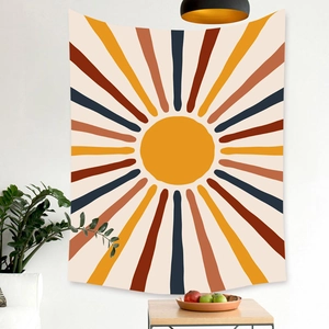 Detail of Nordic tapestry with vintage sunburst print on wall in home setting