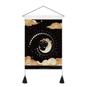 Detail of moon phase tapestry with calendar numbers, wooden rod, and black tassels