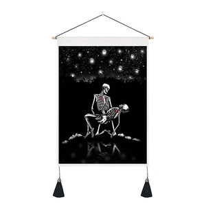 Detail of gothic skeleton tapestry with red hearts, wooden rod and black tassels