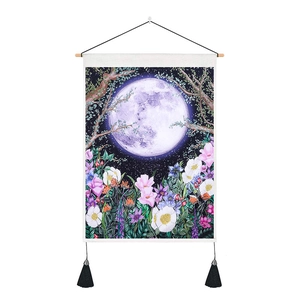 Wall hanging tapestry with purple moon and colorful flowers on vertical wooden frame