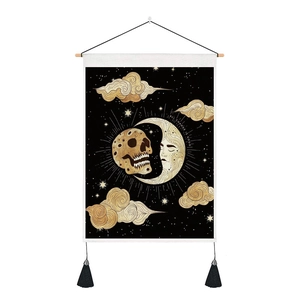 Mystical skull and moon tapestry with black canvas, golden stars, and wooden hanging rod