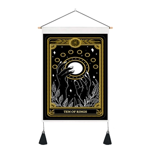 Detail of Ten of Rings tarot tapestry with black and gold print and elegant tassels