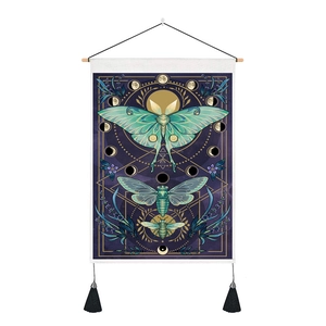Macro view of butterfly and moon phase tapestry with wood hanger and black tassels