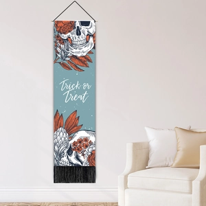 Halloween Trick or Treat skull wall tapestry with floral details and black tassels