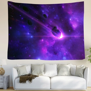 Detailed view of cosmic starry sky tapestry hung above a modern white sofa with plants