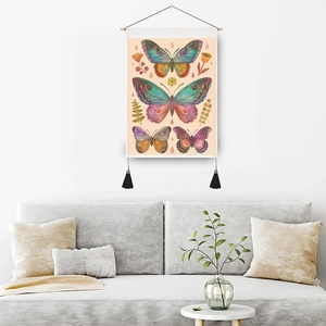 Vintage butterfly tapestry with wooden pole and tassels hanging on a living room wall