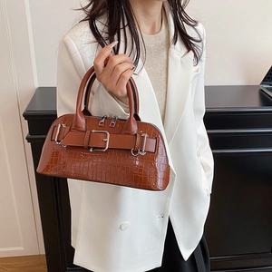Brown crocodile pattern shell handbag with belt buckle detail and silver hardware