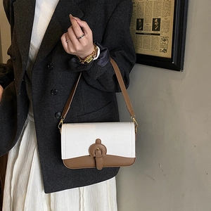 Retro patchwork underarm bag with white textured flap and brown leather details for women