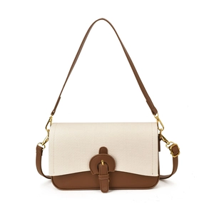 Two-tone retro crossbody bag featuring cream woven fabric and dark brown leather accents